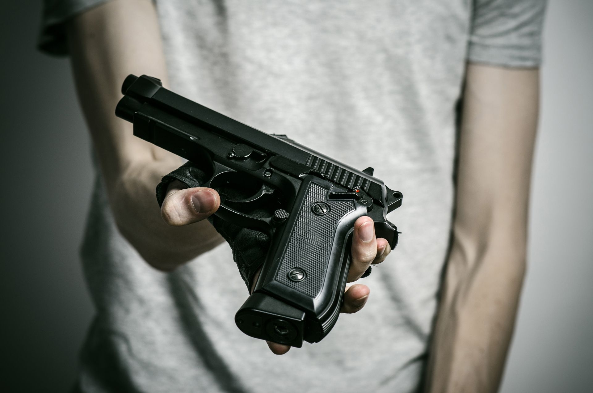 Man holding a firearm